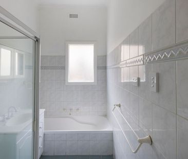 This beautifully presented, spacious three-bedroom home is ideally ... - Photo 5