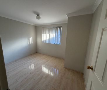 Spacious Top-Floor 2 Bedroom Unit with Lock-Up Garage & Balcony - Photo 3