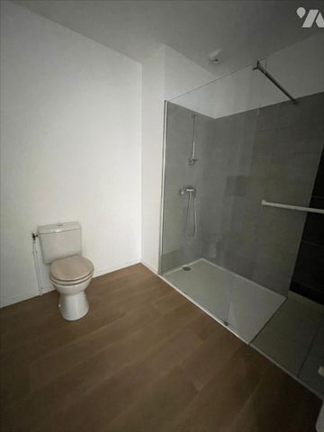 Résidence récente - F2 en RDC avec terrasse et parking - Photo 4