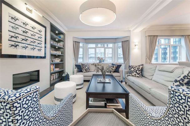 Beautiful interior designed 1st floor flat with generous proportions, 24 hour porter, air conditioning in the main bedrooms and communal gardens access. - Photo 1