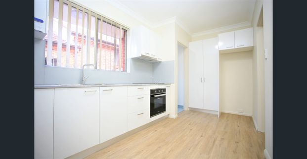 Modern 2 bedroom unit with garage - Photo 1