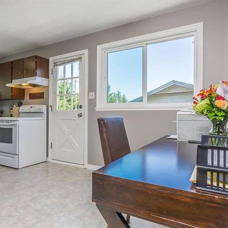 Upper Three Bedroom Suite with Laundry and Fenced Yard - Photo 1