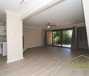 TWO STORY, THREE BEDROOM TOWNHOUSE LOCATED IN THE HEART OF THE JUNC... - Photo 1