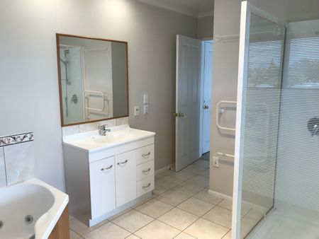 This is a stunning executive home, welcomed through the entrance way to the open dining or family, the large kitchen, with bifold doors that take you through to your own private patio with a stunning view. - Photo 3