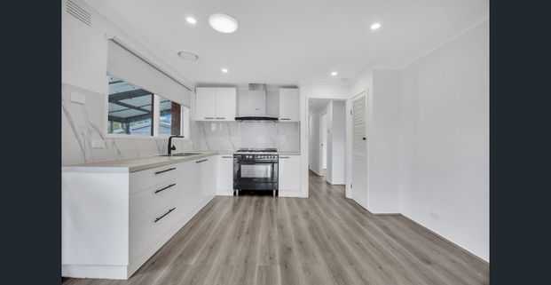 Bright Family Home with Space, Style & Security - Photo 1