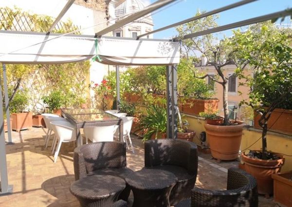 Attic-Monti: 1-6 month rentals. Spacious, furnished 3 Bedroom, 2 bath, living room, dining room, study and large panoramic terrace. Bright, silent, located in well kept Palazzo d’Epoca with elevator and doorman. Near transport and Metro.