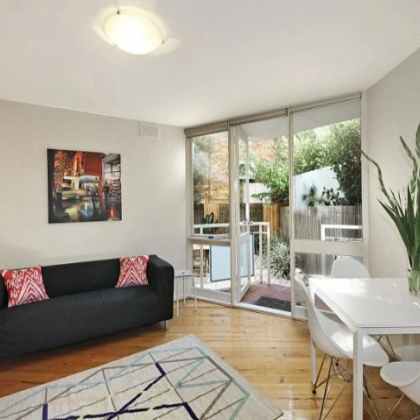 Courtyard Living Close to it All! - Photo 1