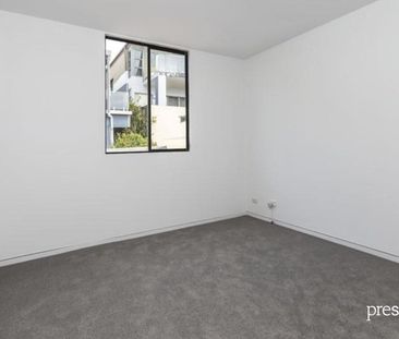 BEACHFRONT LIVING IN THIS SPACIOUS AND TIDY RESIDENCE - Photo 2