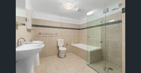 SPLIT-LEVEL TWO BEDROOM TOWNHOUSE IN TIGHTLY HELD COMPLEX - Photo 2