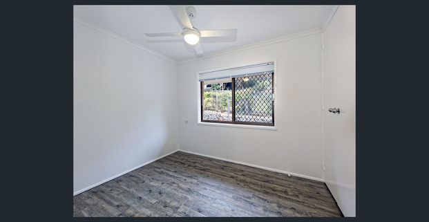 Spacious Family Retreat with Poolside Entertaining in Leafy Jindalee - Photo 1