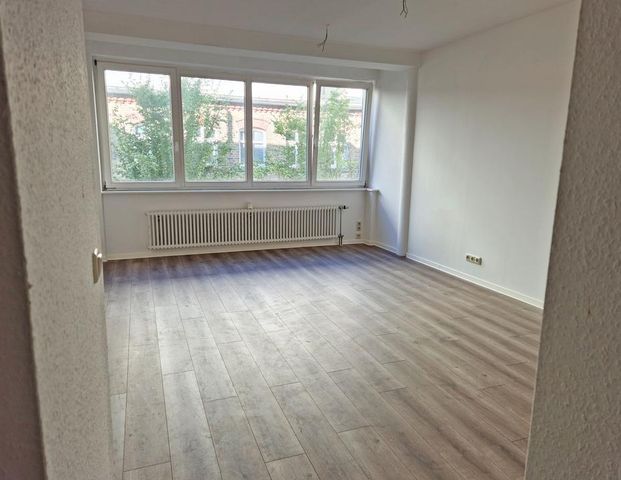 Traumwohnung im 1. OG: Modern, offen und familienfreundlich! - Foto 1