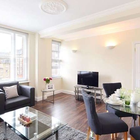 This fifth floor apartment is set over 728 sq ft approx and comprises of two double bedrooms, two modern bathrooms, reception room with rear facing views over Hay’s Mews. - Photo 1