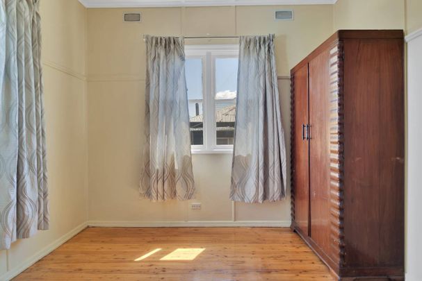 Classic Comfort in Centenary Heights - Photo 1