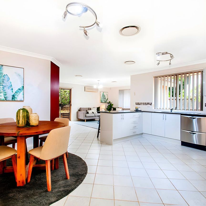 Modern and light filled haven in family friendly locale - Photo 1