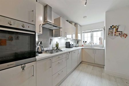 Situated in a peaceful location with open green space to the front, this spacious family home is arranged over three floors and offers well-presented accommodation throughout. - Photo 5