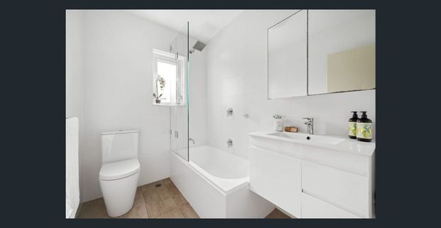 BOUTIQUE BEACH RETREAT WITH NORTH-FACING BALCONY - Photo 1