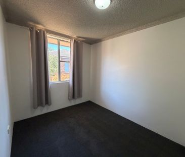 Centrally Located Two Bedroom Unit with Air Conditioning! - Photo 1