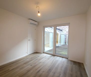 GELIJKVLOERS APPARTEMENT IN HET CENTRUM - Photo 2