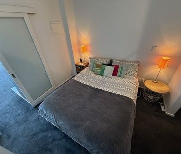Top-Floor 1-Bedroom Apartment with Balcony - Photo 2