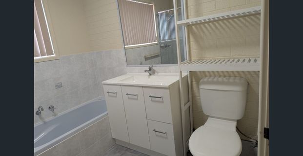 Spacious two bedroom townhouse in a quiet cul de sac. Complete with fully fenced yard and single garage with internal access. - Photo 1