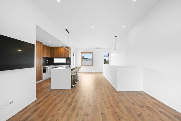 Discover the perfect blend of design, space, and location in this stunning three-bedroom, two-bathroom home over two levels on Victoria Street. - Photo 1