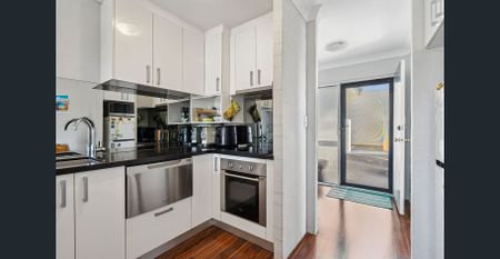 Top-Floor Living with Pool Views - Photo 4