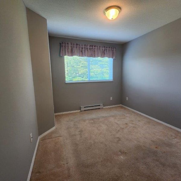 Spacious Two Bed Condo in Langley with Parking and Storage - Photo 1