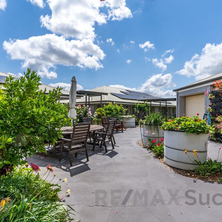 Low-Maintenance Living with Private Courtyard in Glenvale - Photo 1