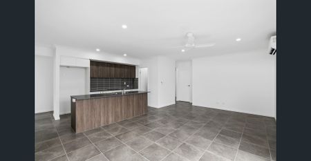 Experience Modern Luxury at its Finest: Stunning Rental Property in Logan Reserve - Photo 3