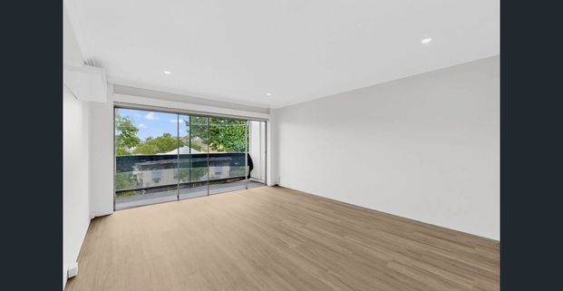 Stylish 2-Bedroom Unit with Balcony & Modern Comforts - Photo 1