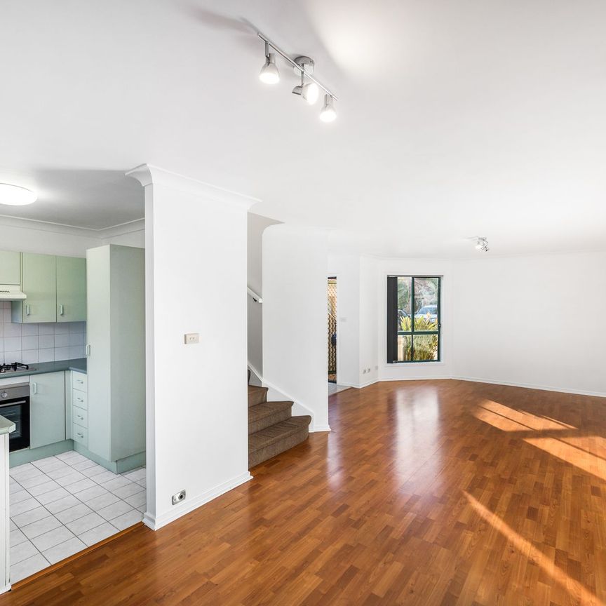 IMMACULATE TOWNHOUSE WITH POOL - Photo 1