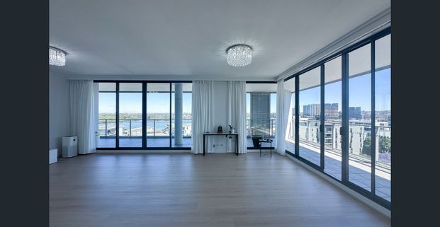 Luxury Apartment with Spectacular Water Views | Top Floor of Complex - Photo 1