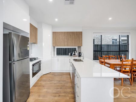 Open the Door to Sun-Soaked Living in a Premium Woodville West Pocket - Photo 2