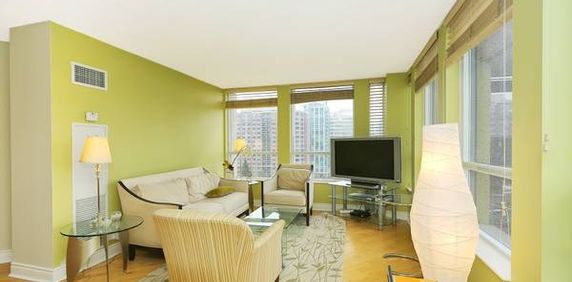 Cheerful 2 Bedroom with 2 Bathrooms plus Balcony and Hardwood Floors - Photo 2