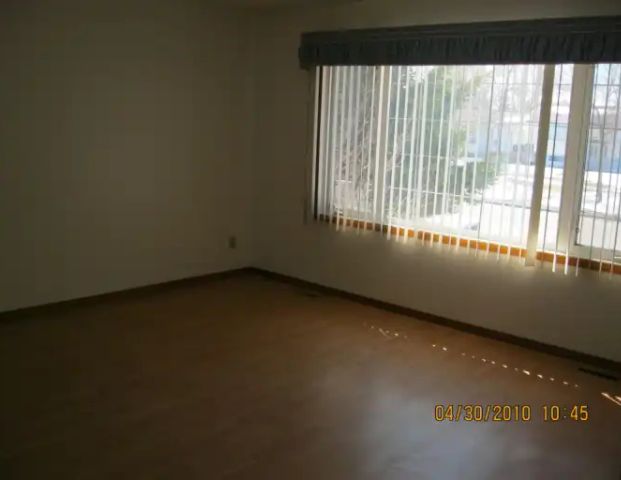 cozy upstairs three bedroom house in Rundle | 5120 26 Avenue Northeast, Calgary - Photo 1