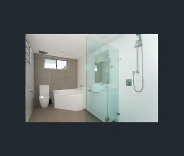 Stylish Beachside Apartment with Generous Living Spaces - Photo 4