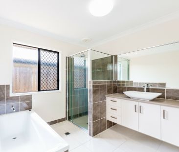 Spacious Three-Bedroom Unit with Flexible Living Options - Photo 4
