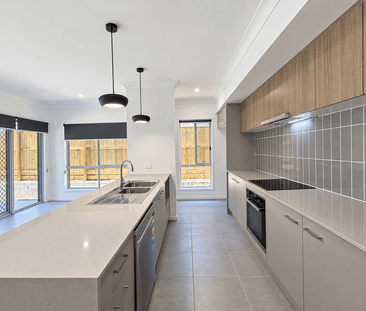 Modern 4-Bedroom Family Home with Double Garage in Greenbank - Photo 5