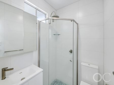 Open the Door to Coastal Charm with Modern Comfort - Photo 3