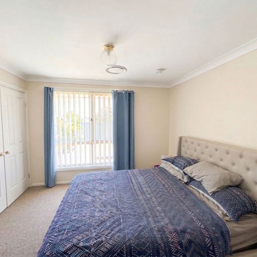 Spacious Family Home in a Prime Glenmore Park Location - Photo 1