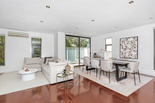 Striking Style, Sophisticated Living - Spacious Three-Level Townhouse! - Photo 1