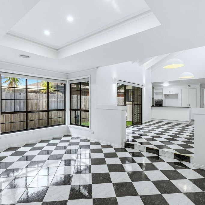 Light-Filled Family Home with 2 Living Spaces in Prime Altona Meadows Location - Photo 1