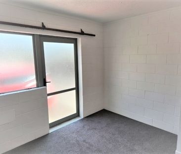 A two-bedroom, one-bathroom unit offering a generous open-plan livi... - Photo 3