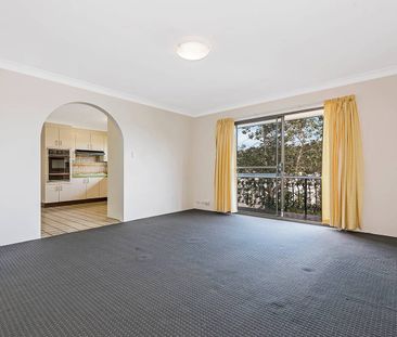 Fresh, Breezy & Exceptionally Located – Walk to Train & Shops - Photo 1