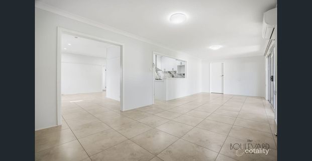 Secure Living at Its Best: 3 Bedrooms, 3 Bathrooms + Massive Backyard & Sunroom - Photo 1