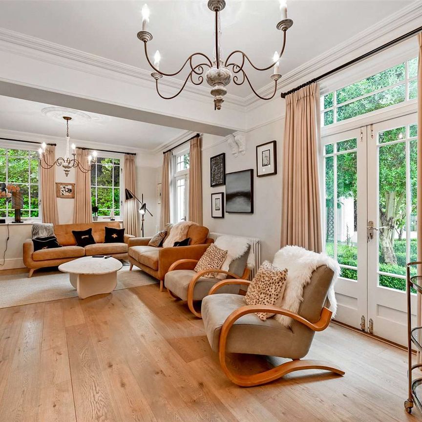 A beautifully presented and detached home in a private gated setting with tranquil gardens, home gym and separate one bedroom annex. - Photo 1