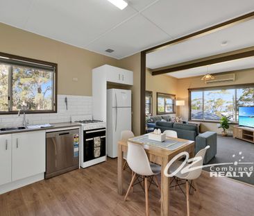 Freshly Updated Home & Fully Furnished with Water Views - Photo 1