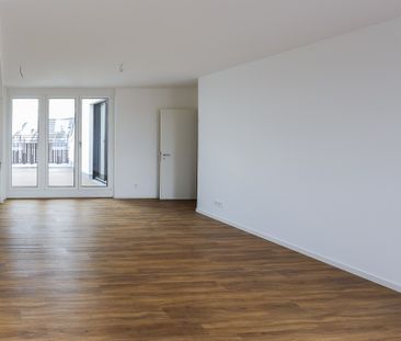 Dachgeschosswohnung mit großzügiger Terrasse - 3 Zimmer auf über 90... - Foto 1