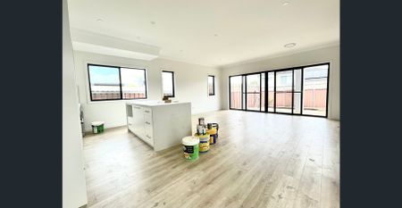 A beautifully presented five-bedroom home in the heart of Moorebank, showcasing modern finishes and a spacious layout designed for comfortable family - Photo 2