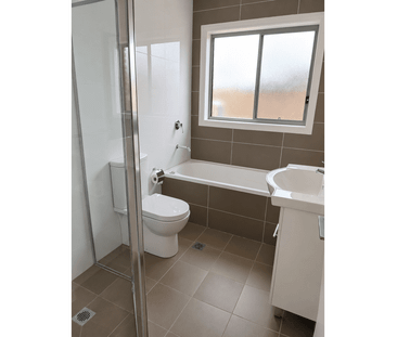 Spacious Three-Bedroom Townhouse in a Convenient Location - Photo 6